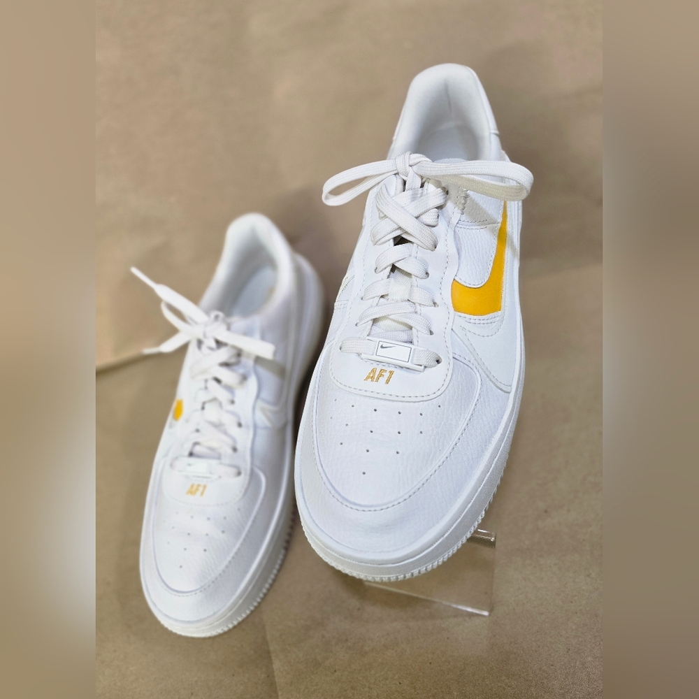 Nike White Sneakers with Black Logo
